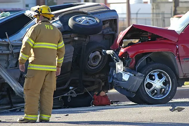 a 2 car motor vehicle accident and fire fighter