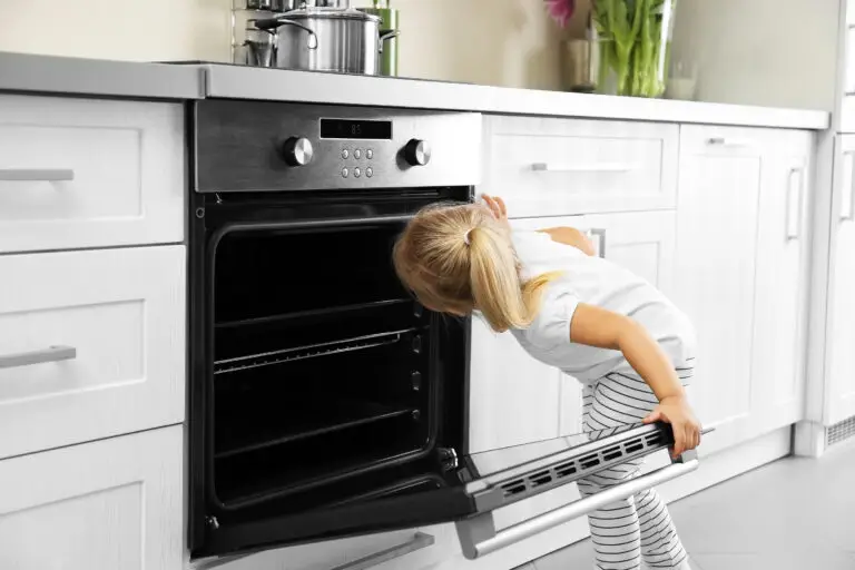 Child looking into oven